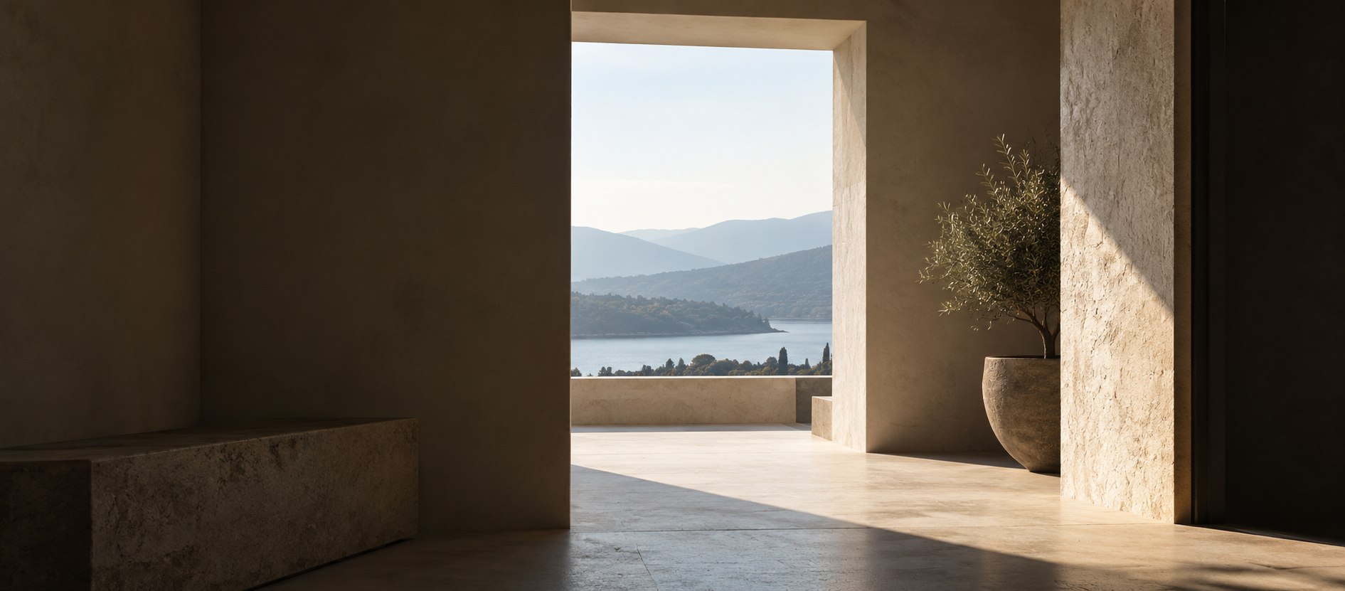 Quiet architectural interior opening toward a clear distant landscape